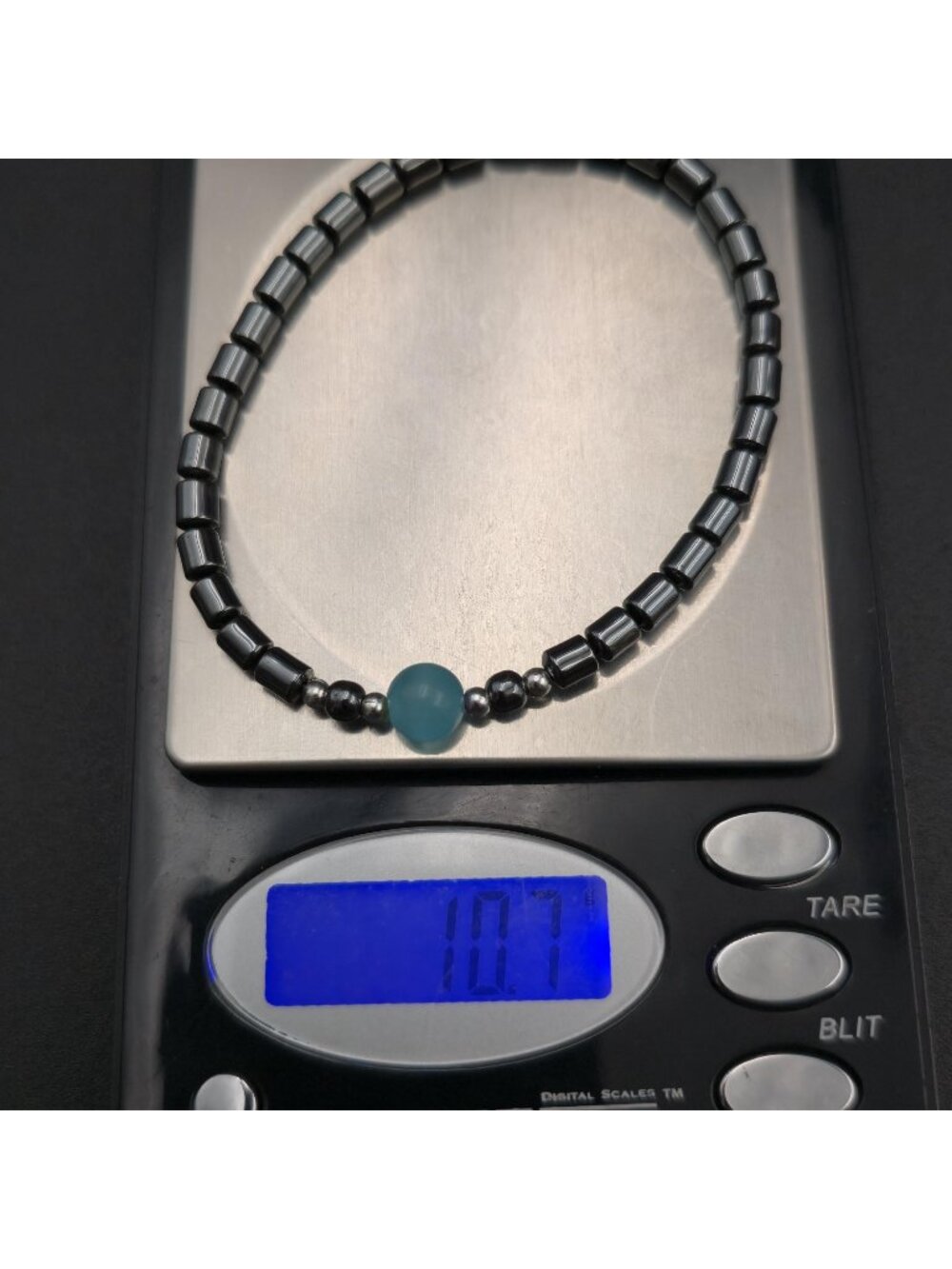 7 Inch Hematite Cylinder Bracelet with Light Blue Cat's Eye Focal Bead Bracelet - Picture 6 of 6